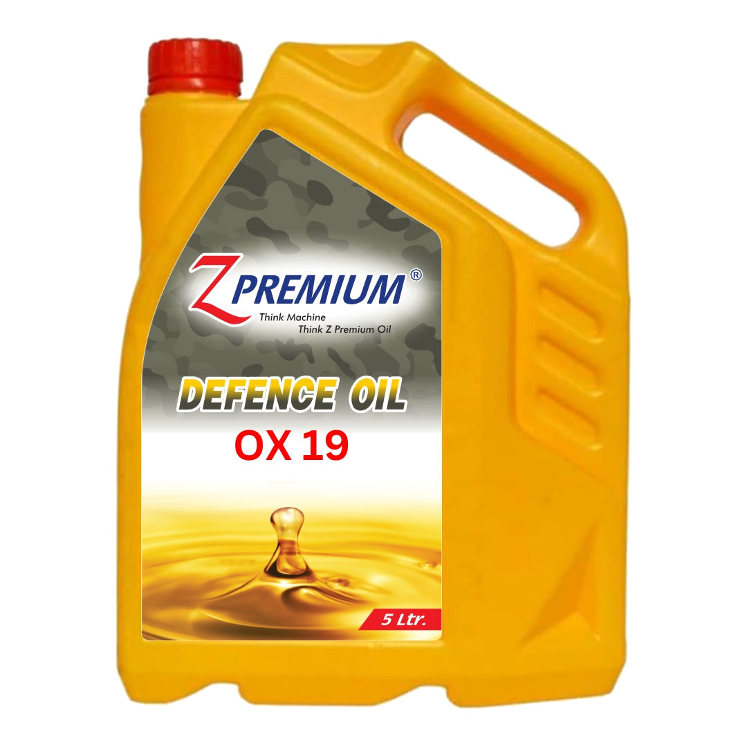 Yellow oil container with red cap labeled