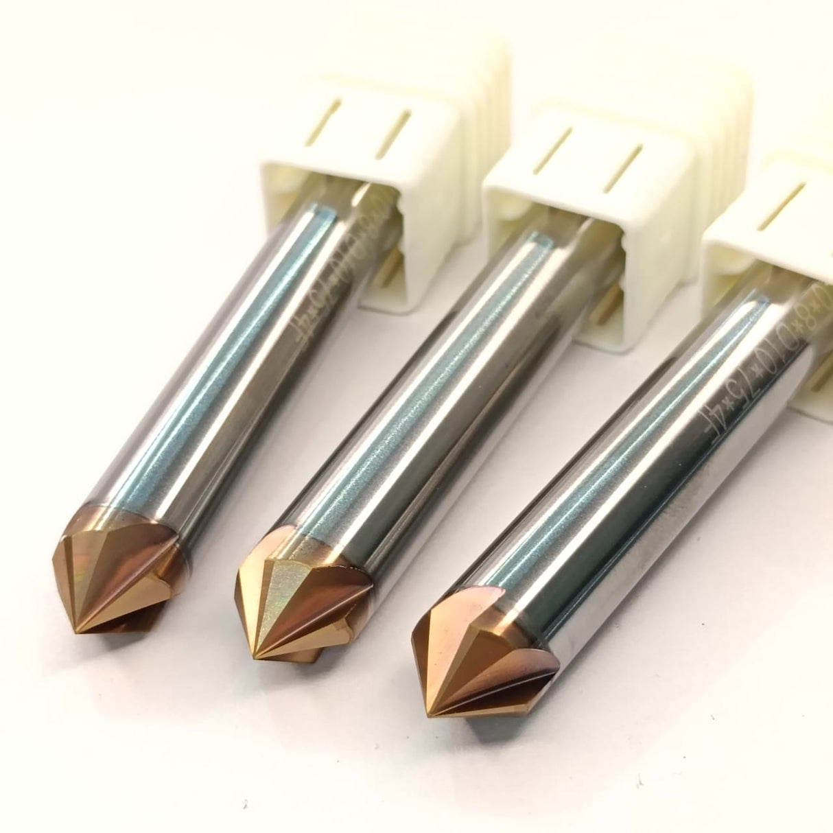 Three metal router bits