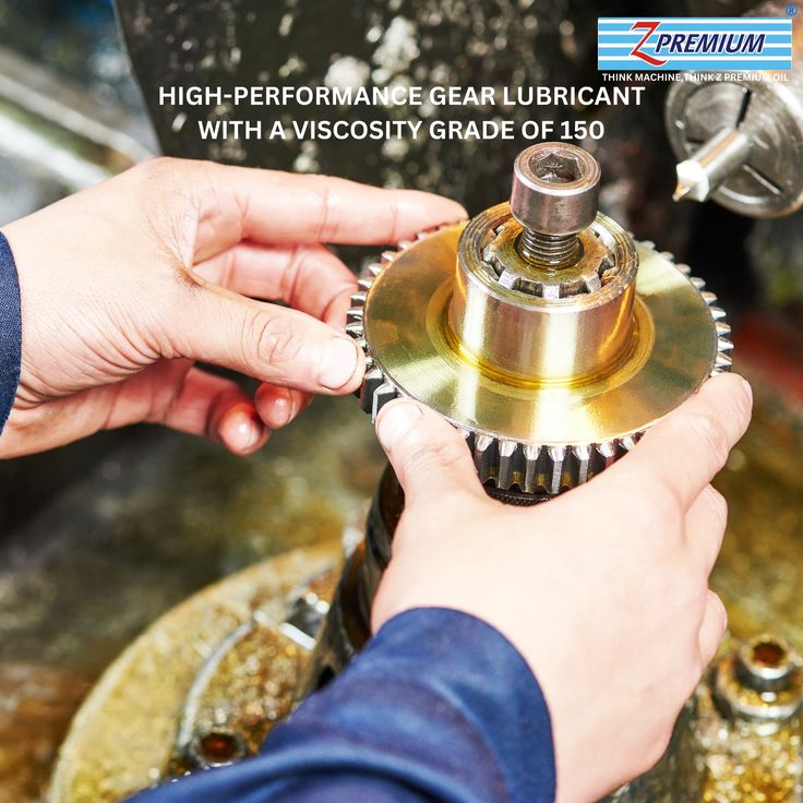 A person applying high-performance gear lubricant to a gear