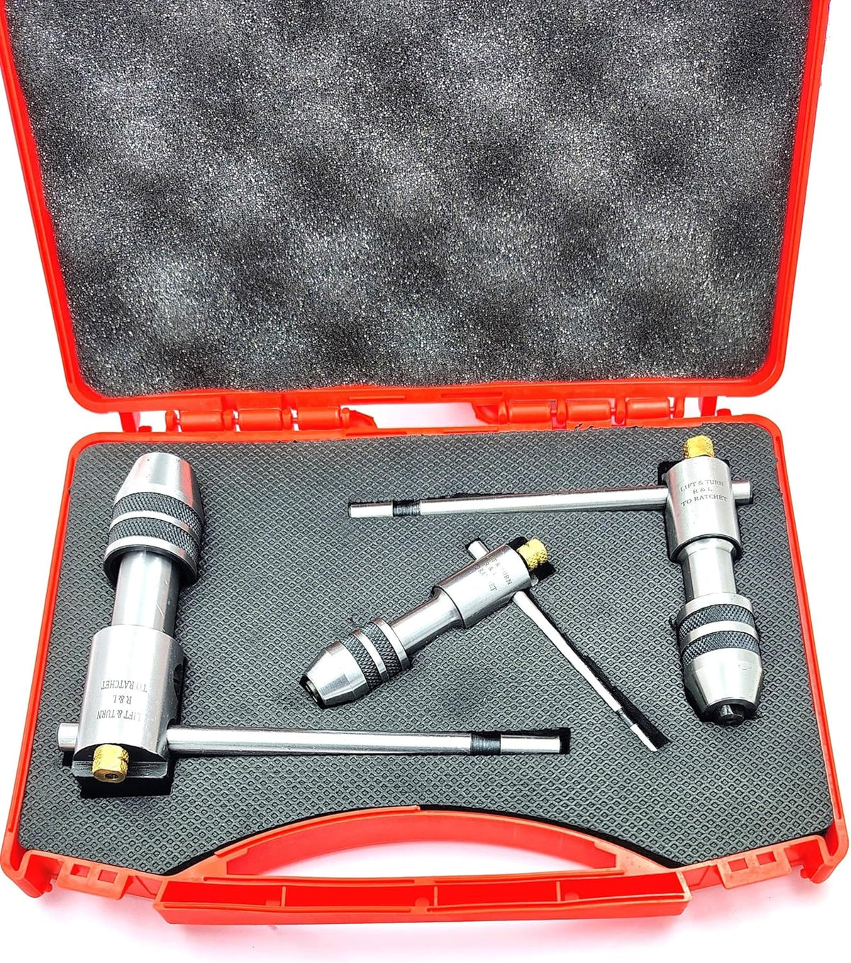Set of 3 ratcheting T-handle tap wrenches in fitted open red carrying case