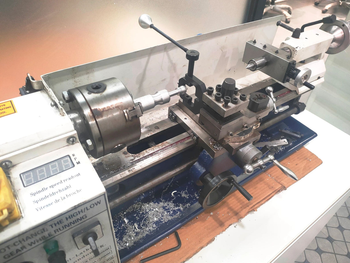 Metal lathe in workshop setting