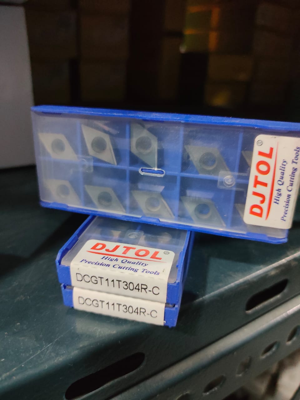 DJTOL cutting tools in blue boxes
