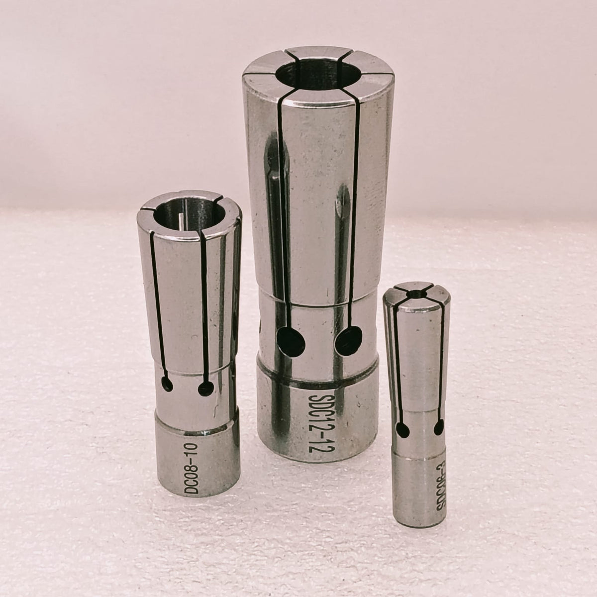 Three metal collets