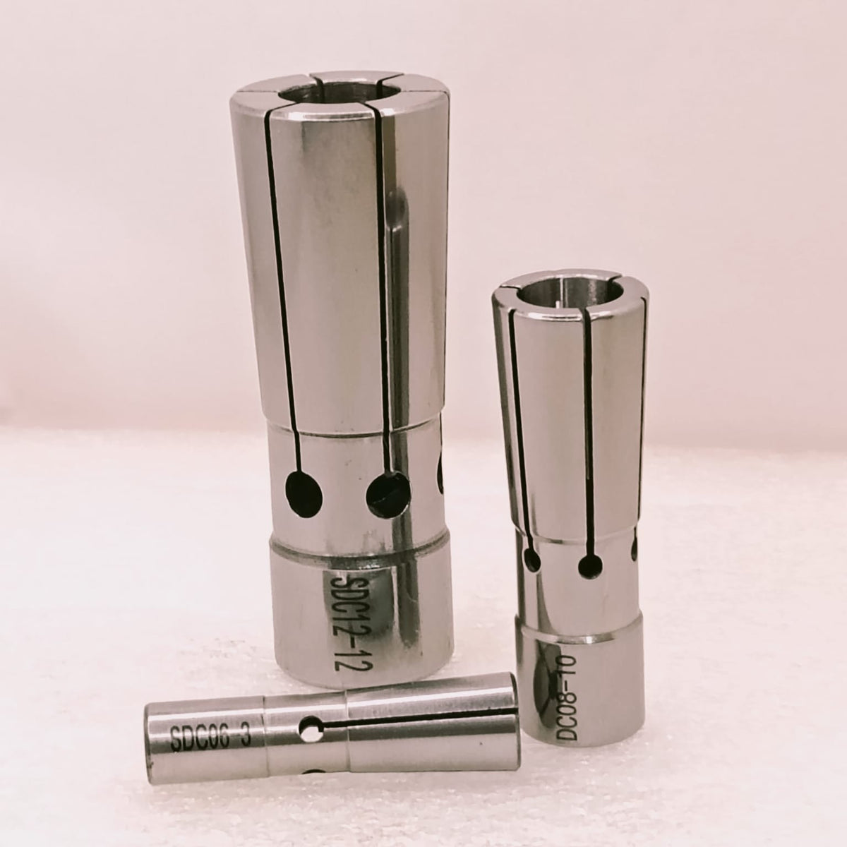 Three metal collets