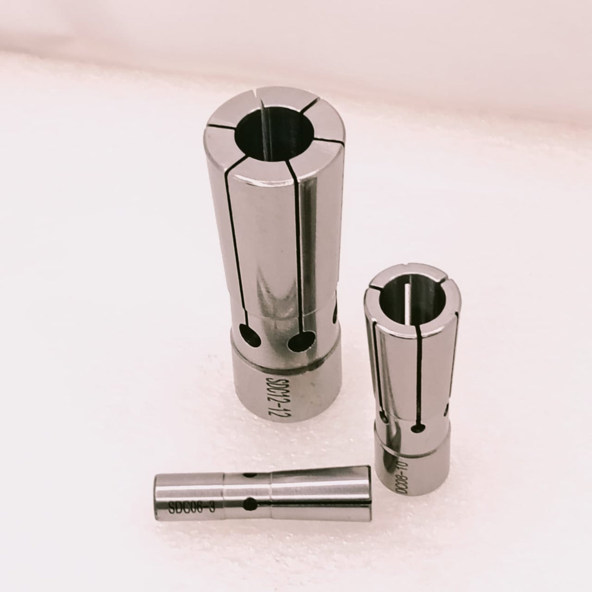 Three metal machining collets