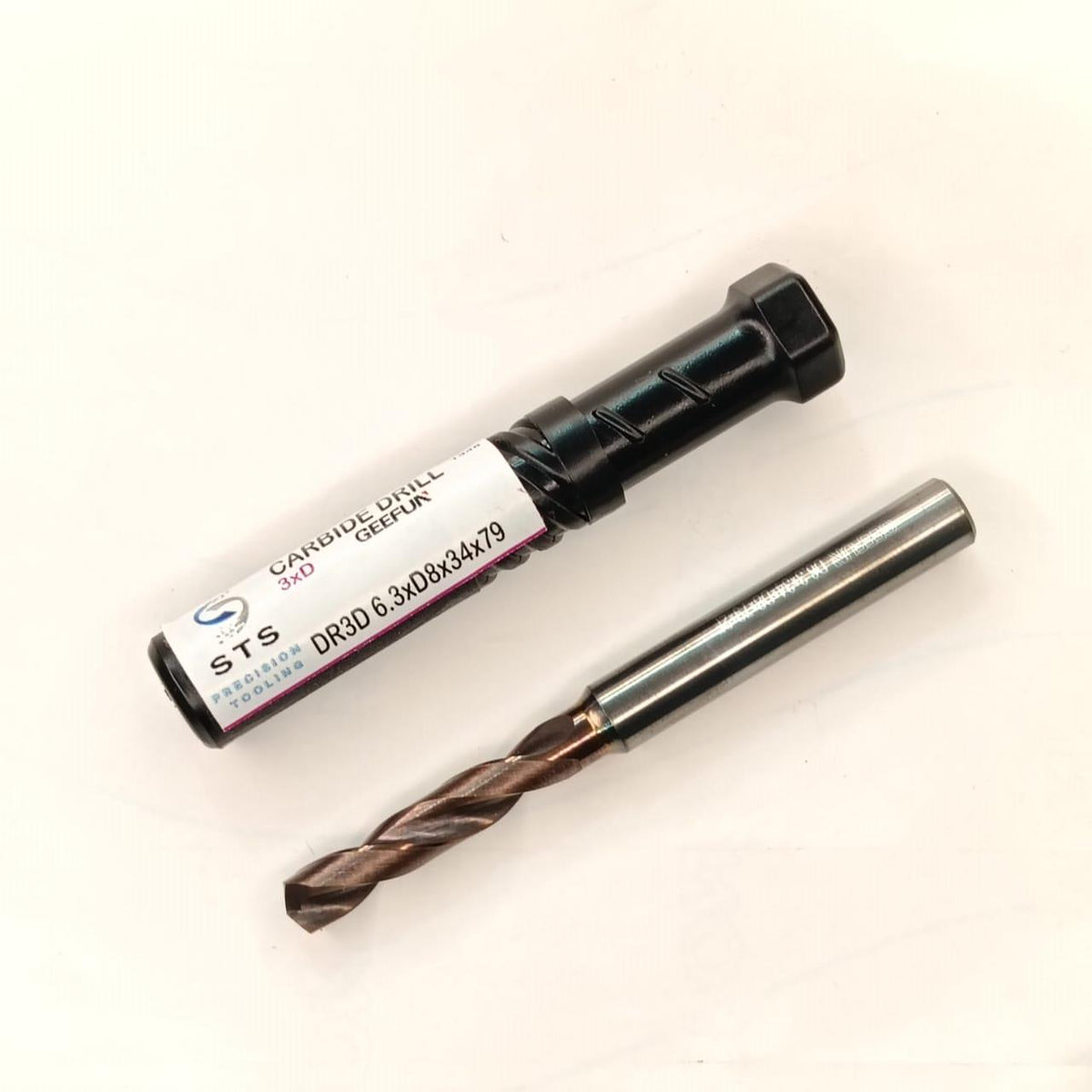 Cylindrical drill bit with packaging