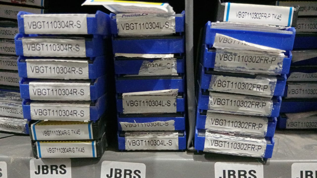 Stacks of metal components labeled