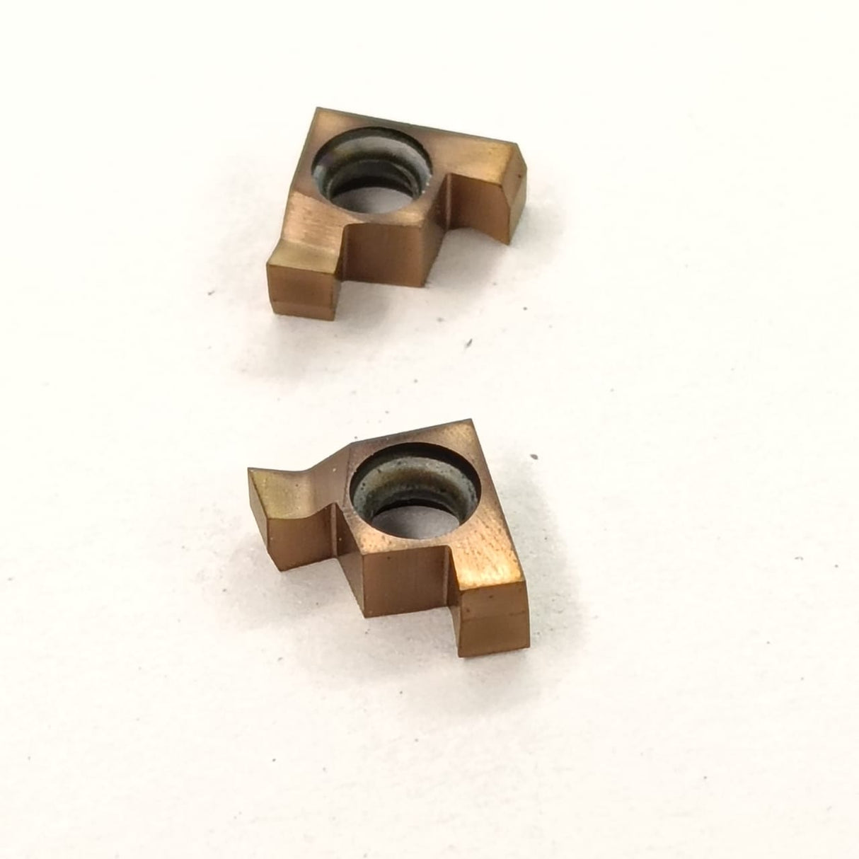 Two bronze metal components