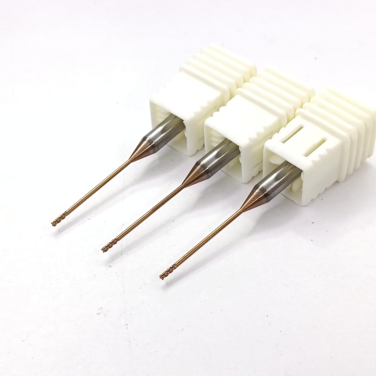 Three dental drill bits