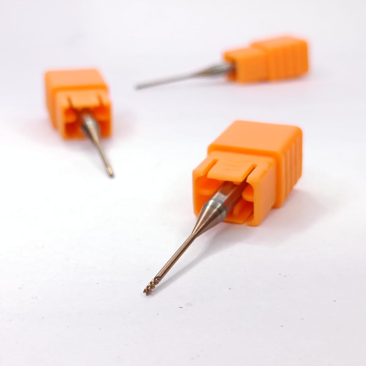 Three dental drill bits