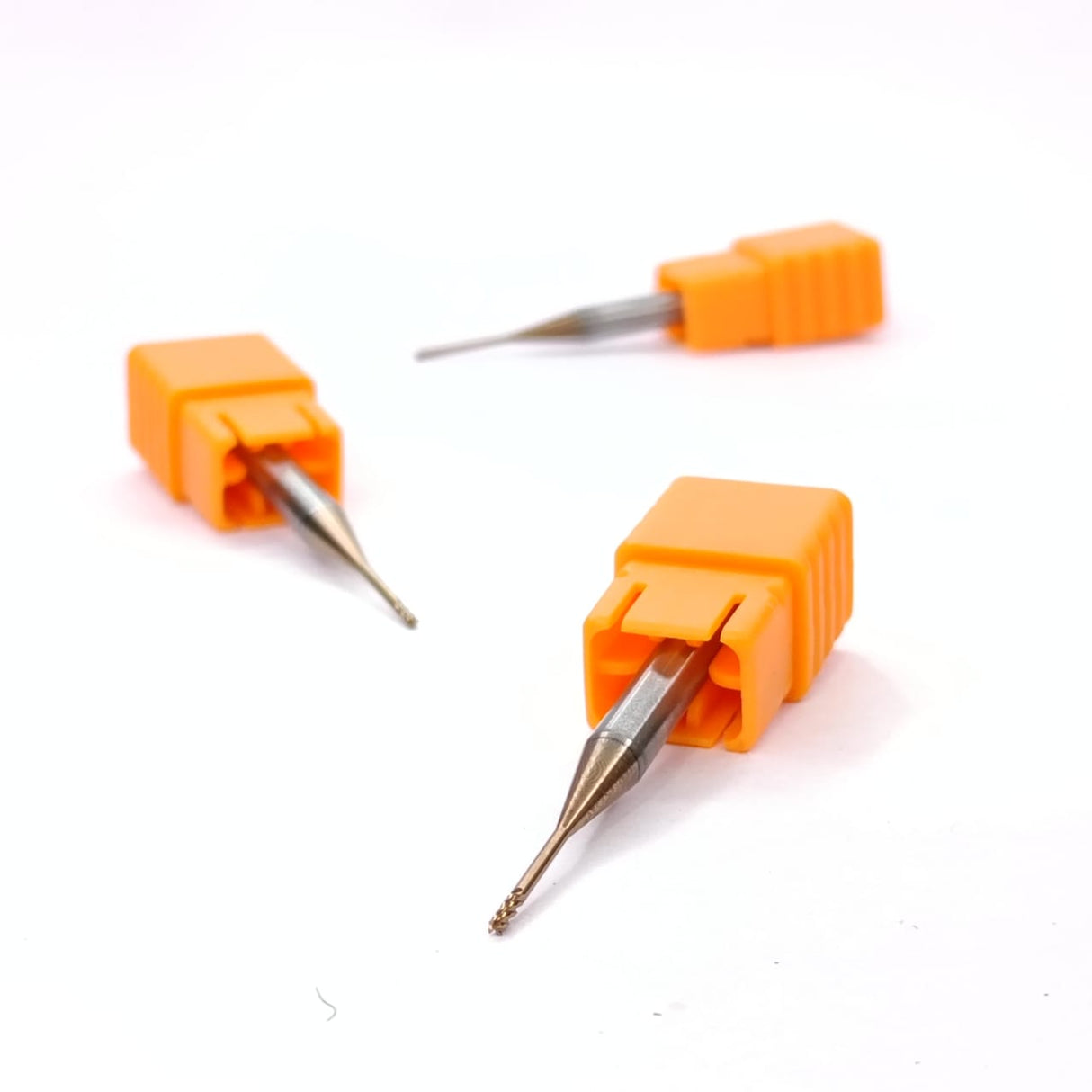 Three dental drill bits