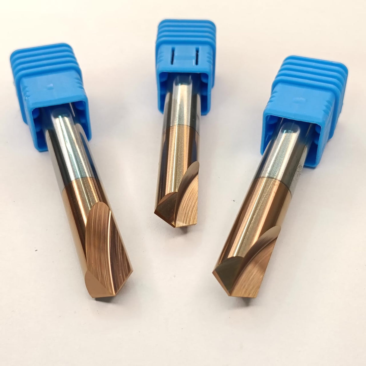 Three metal cutting tools with blue handles