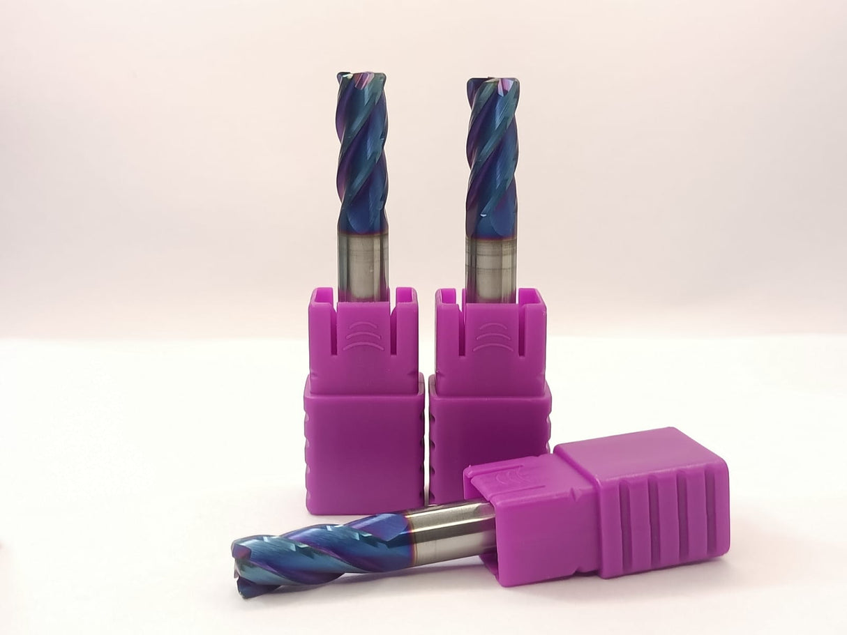 Three drill bits in purple holders