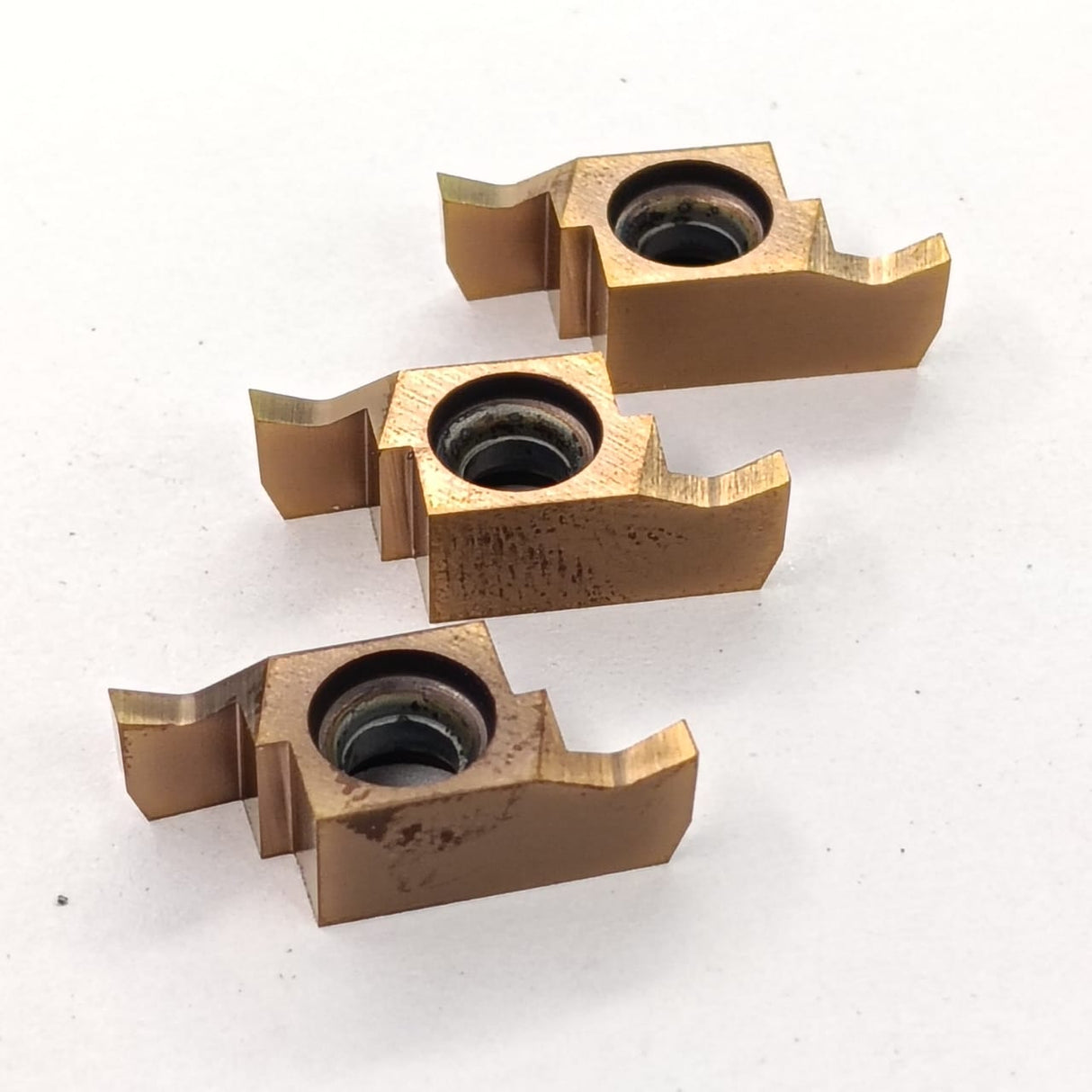 Three metallic cutting tools