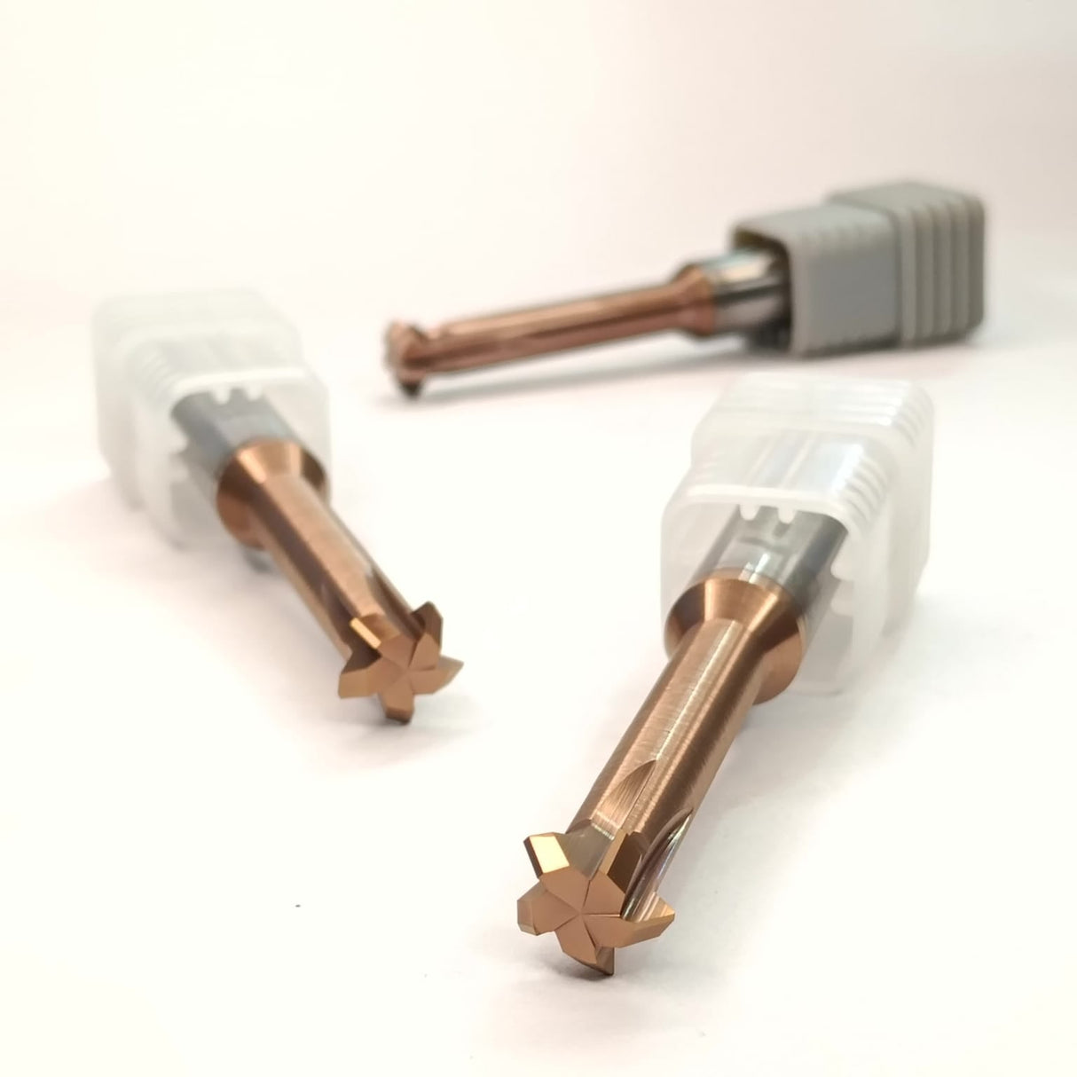 Two metal drill bits with star-shaped tips