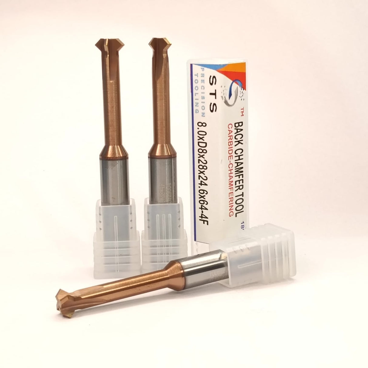 Three metal cutting tools with a packaging box