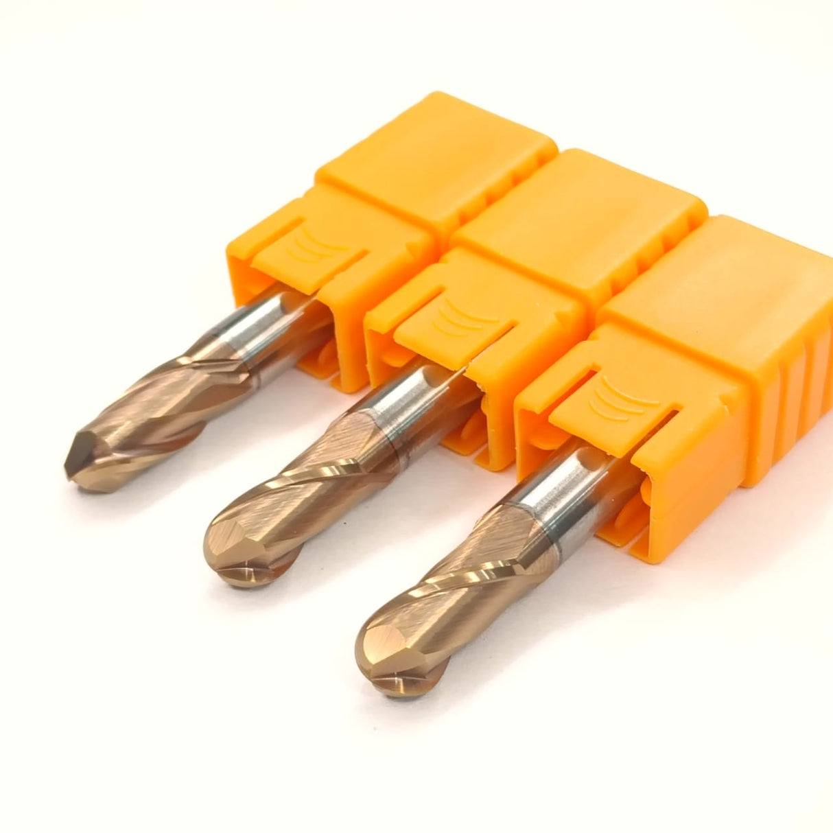 Three drill bits in an orange holder