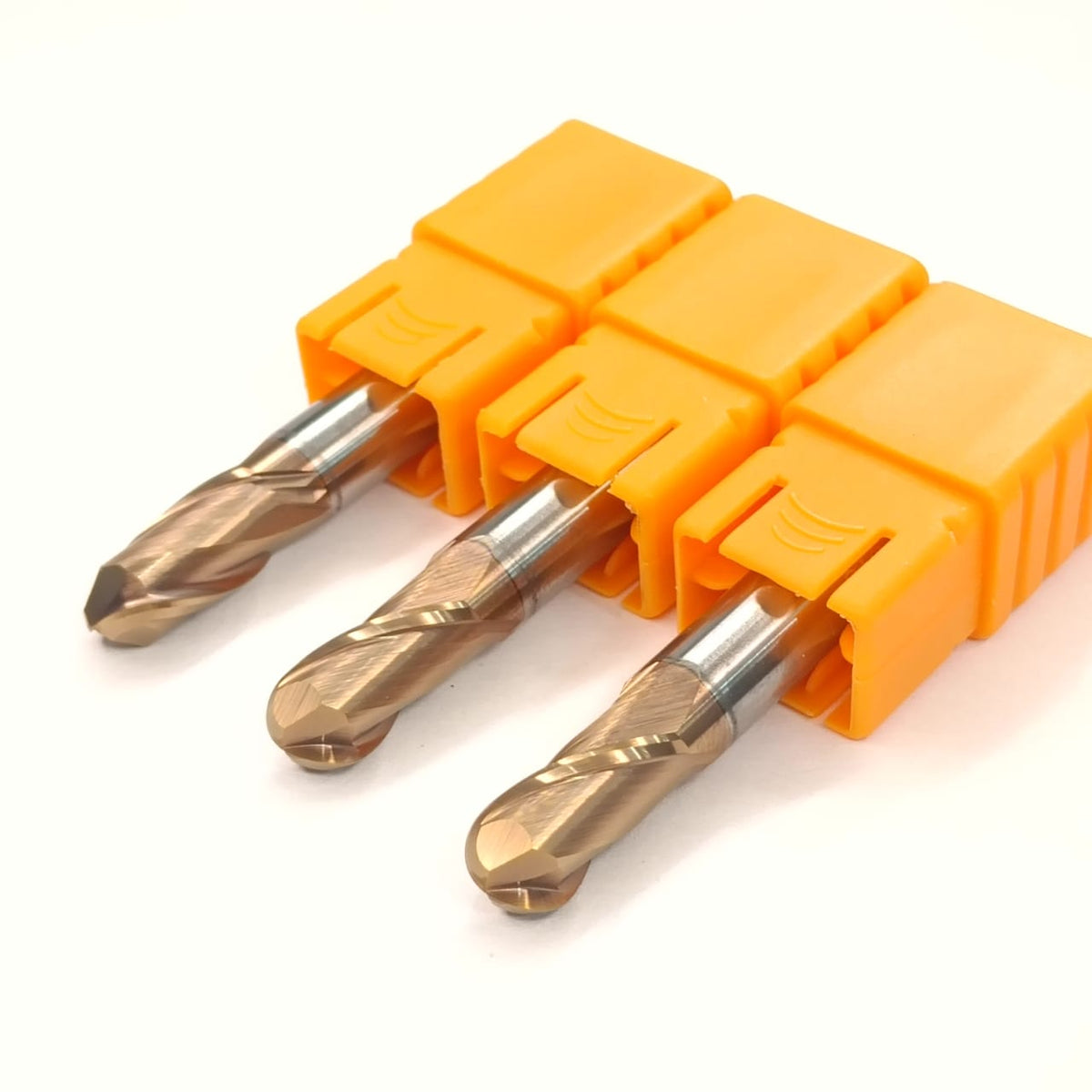 Three drill bits in an orange holder