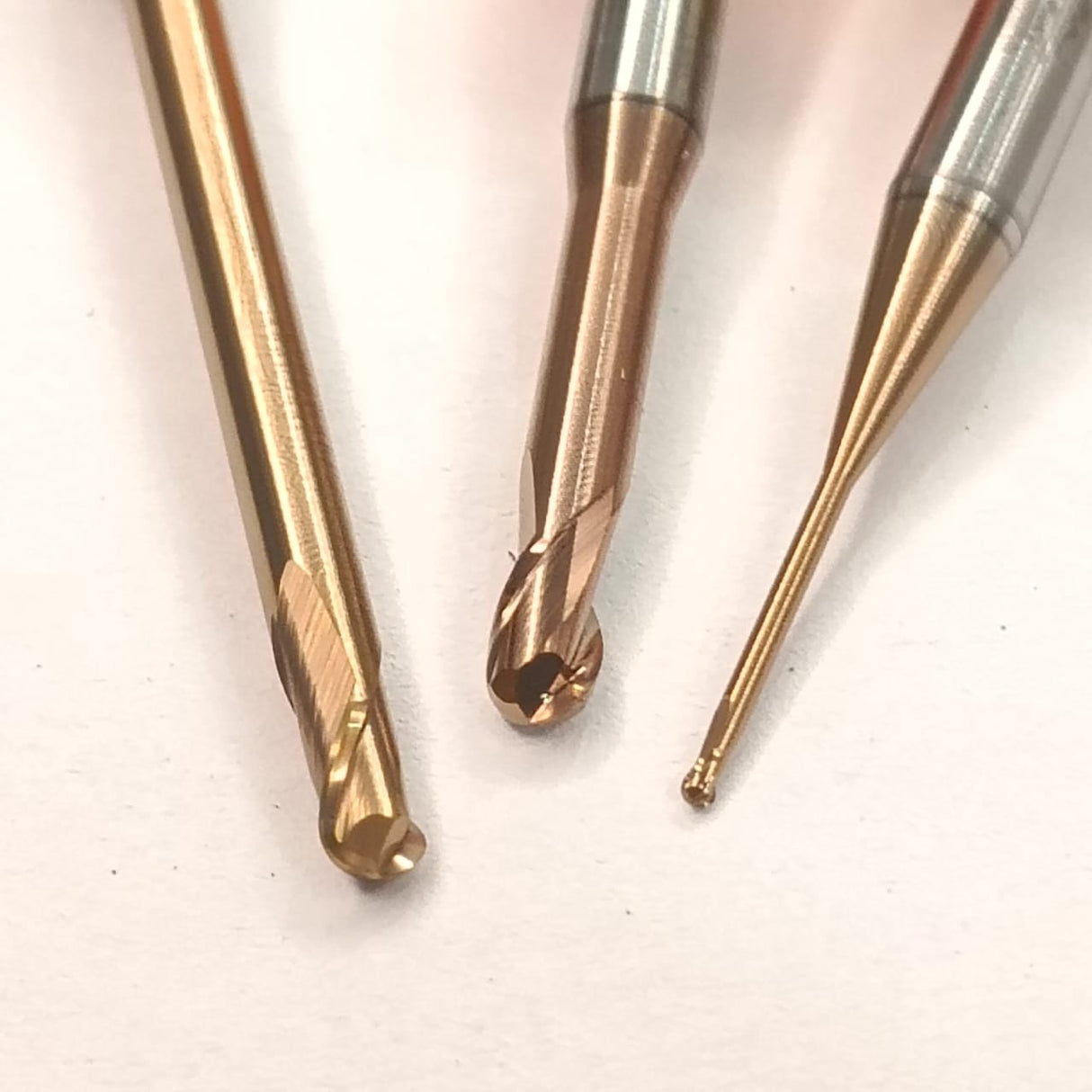 Three metal drill bits