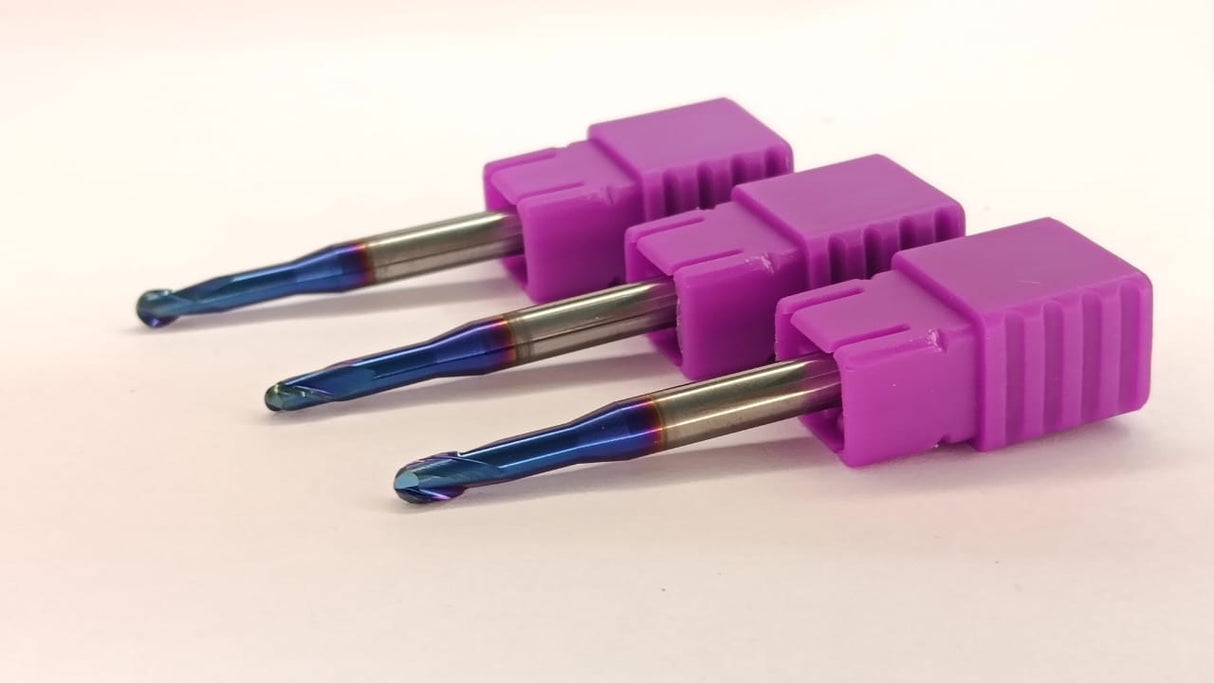 Three purple drill bits with blue tips