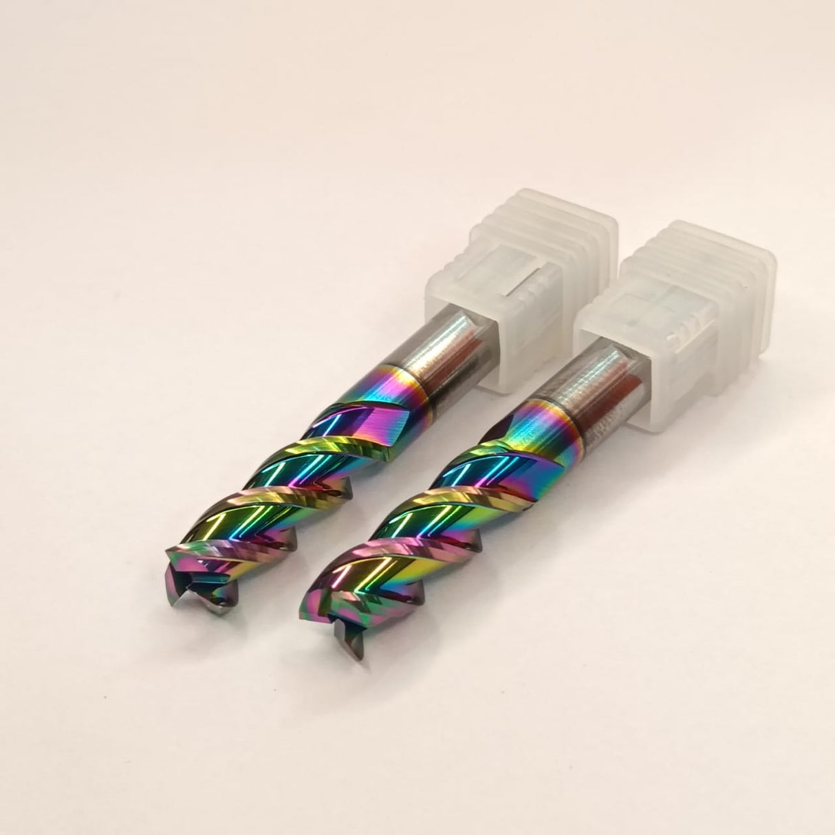 Two rainbow-colored drill bits