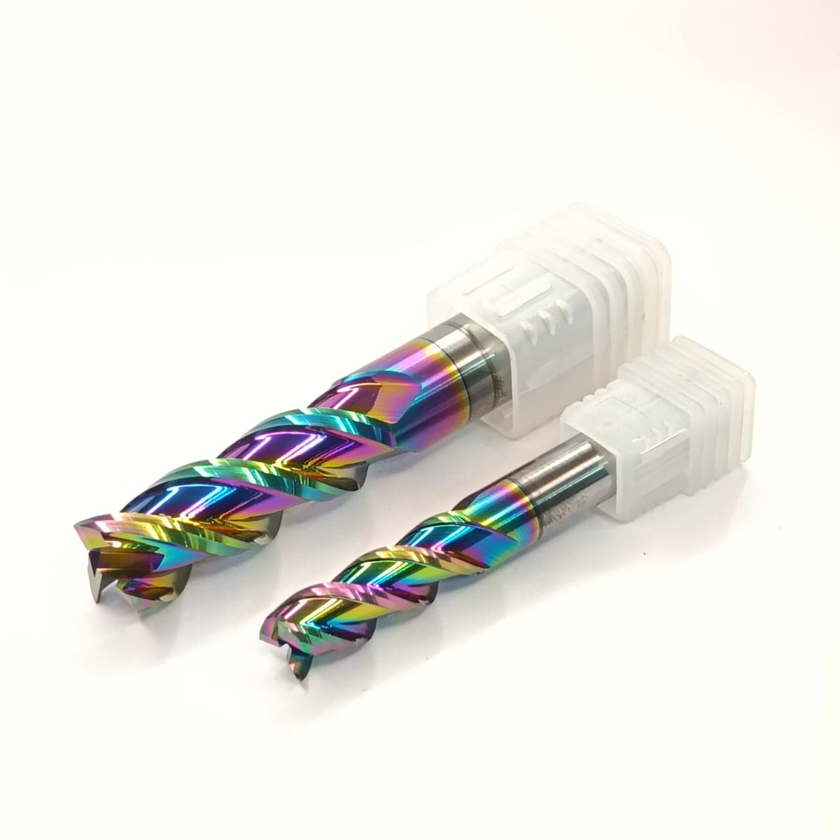 Two colorful drill bits with white handles
