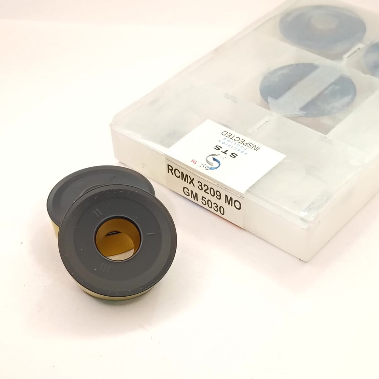 Two black rubber bushings
