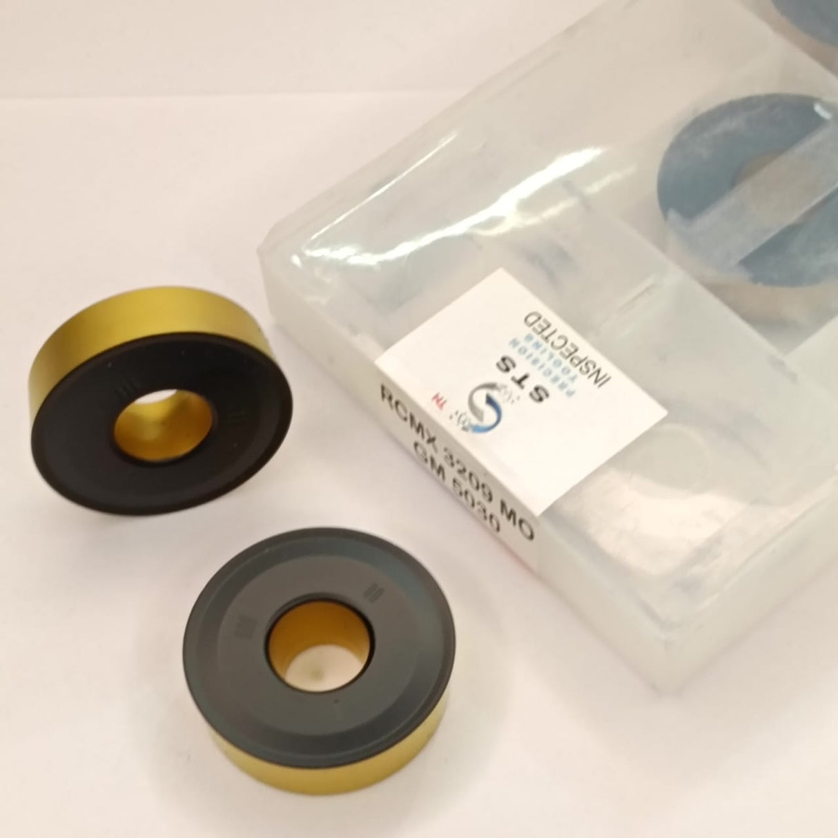 Two circular metallic components