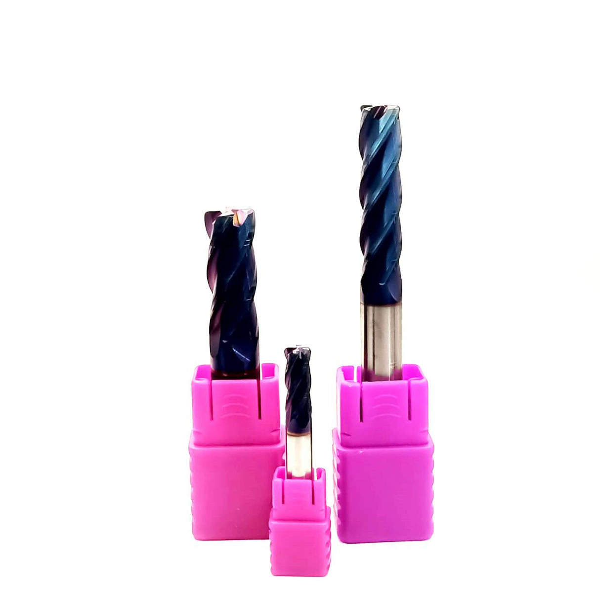 Three drill bits in pink holders