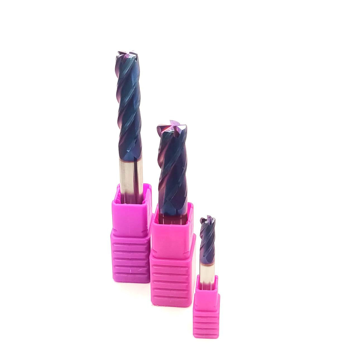 Three drill bits in pink holders