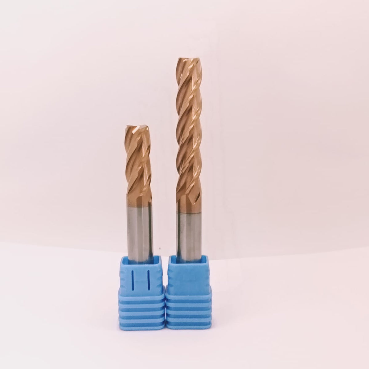 Two drill bits with blue holders