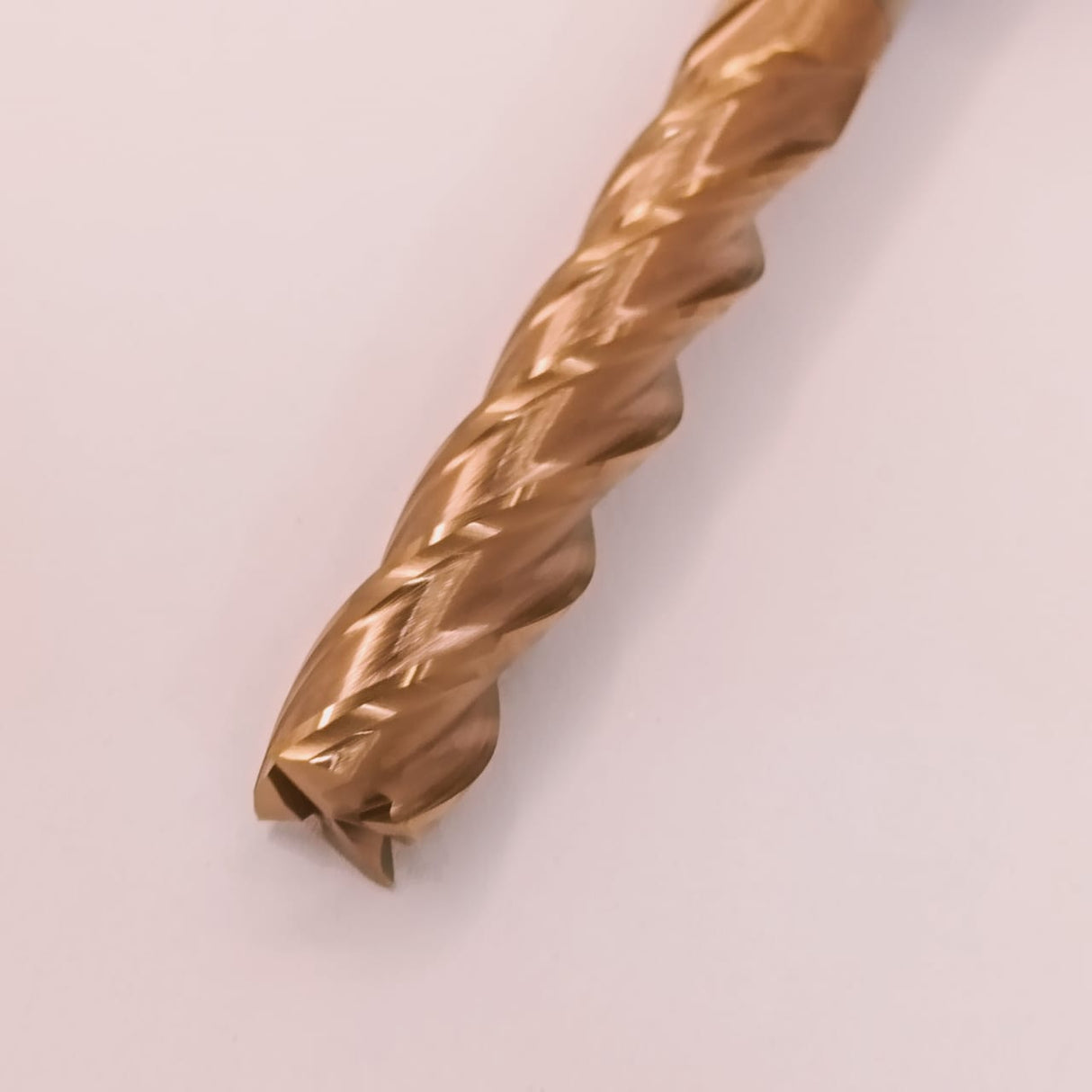 Close-up of a gold-colored metal drill bit