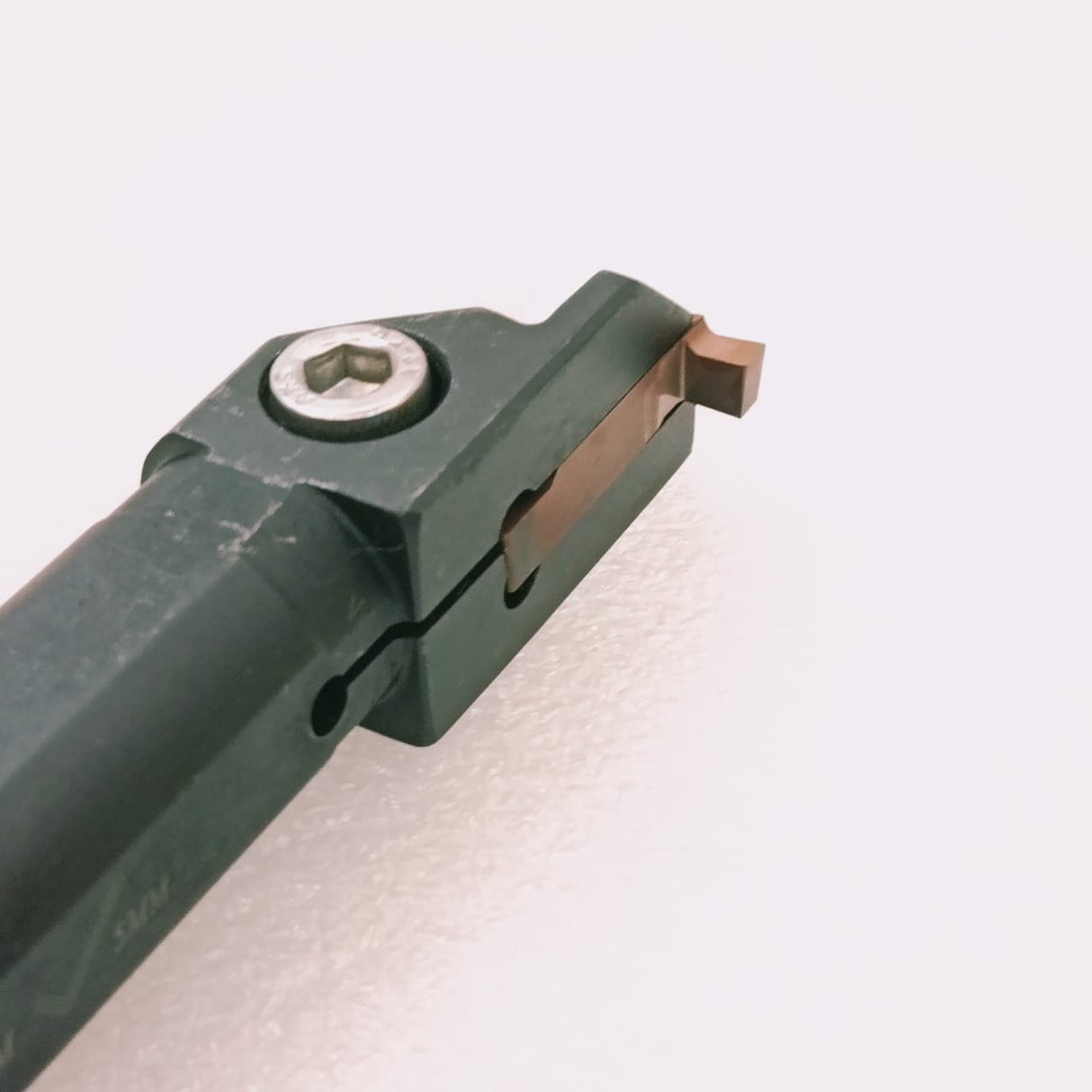 Metal tool holder or cutting insert