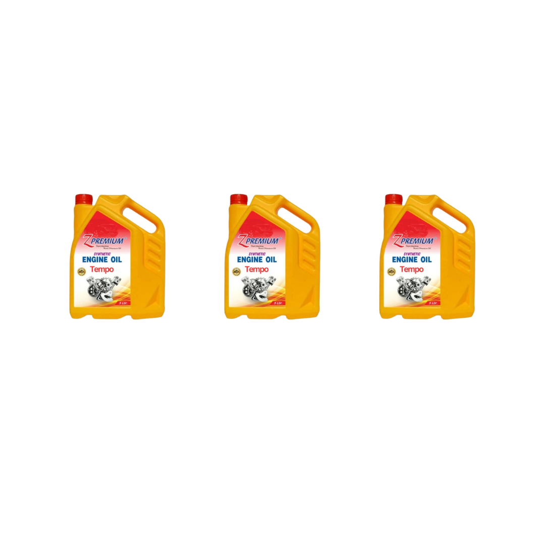Three yellow engine oil jugs with red labels