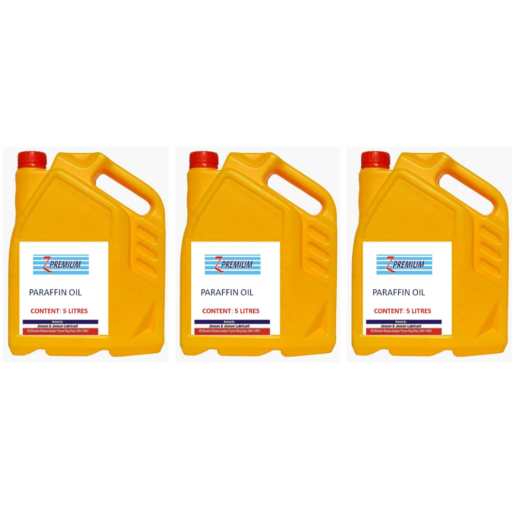 Three yellow paraffin oil containers