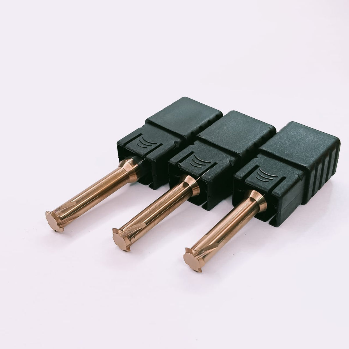Three green electrical connectors