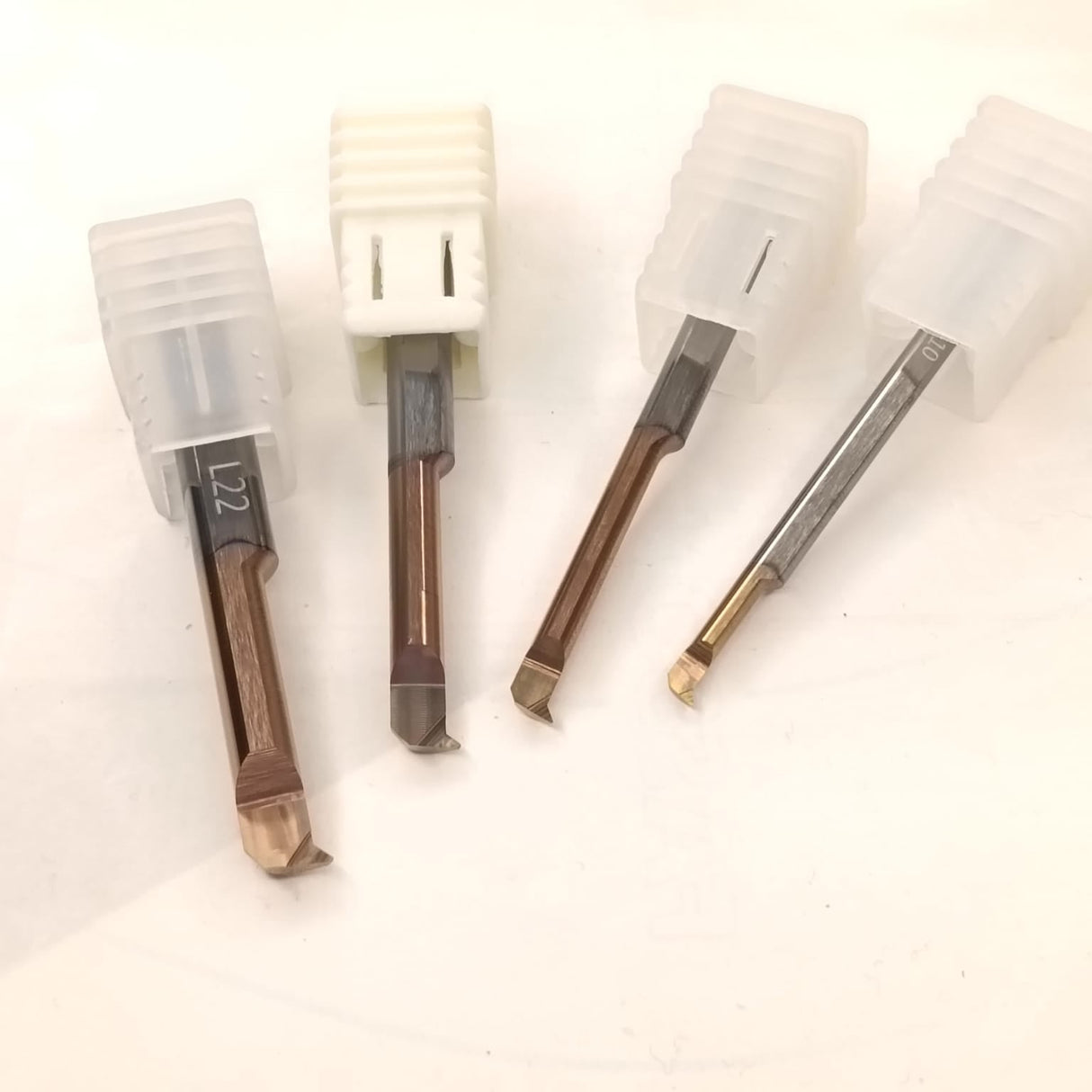 Set of four wooden tools with metal tips