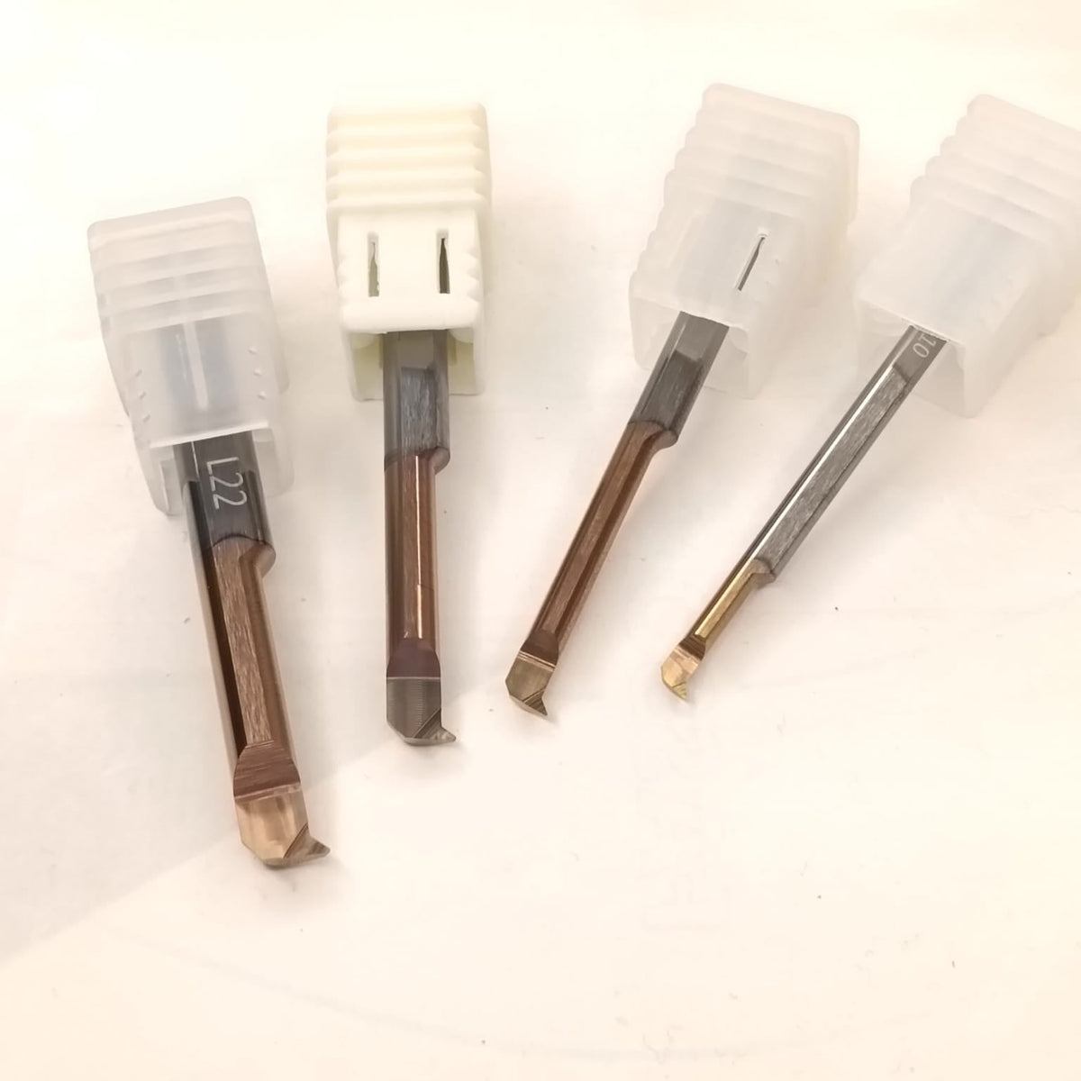 Set of four wooden tools with metal tips