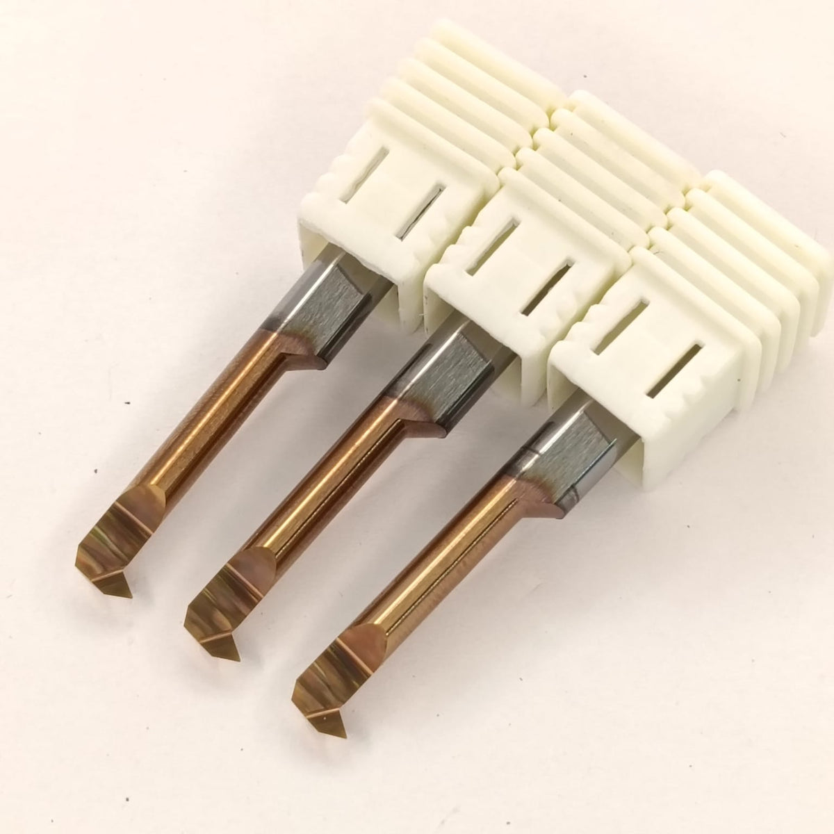 Set of drill bits with a white handle