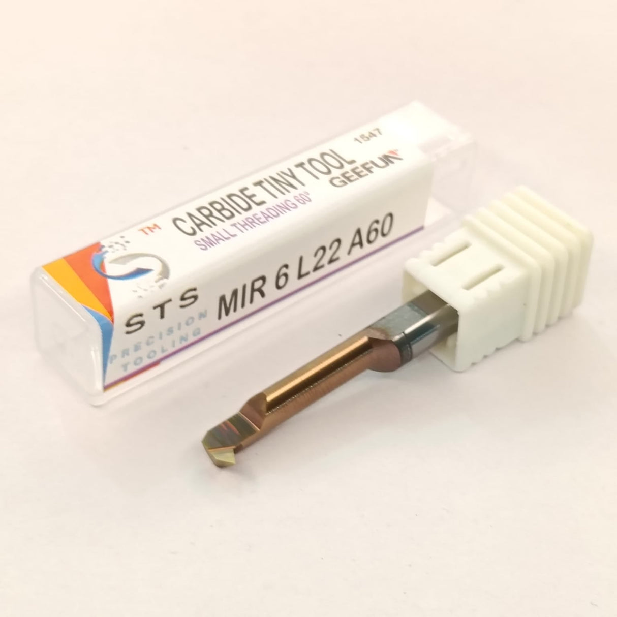 Carbide tool with packaging labeled 'STS