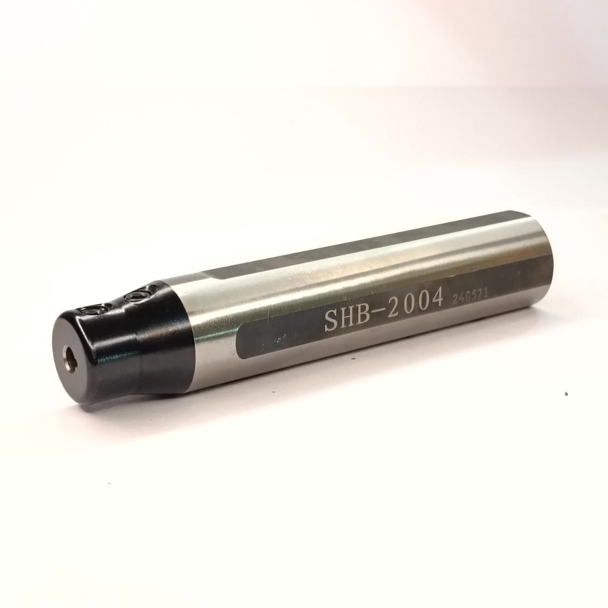 Metallic cylindrical object with 'SHB-2004