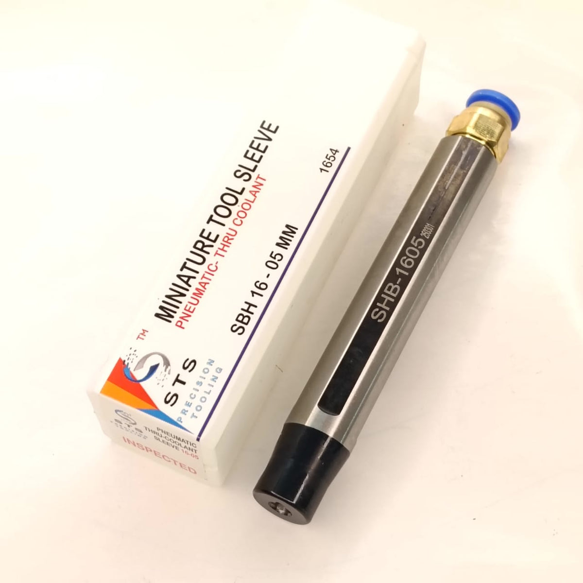 Metal tool with a box labeled 'STS'
