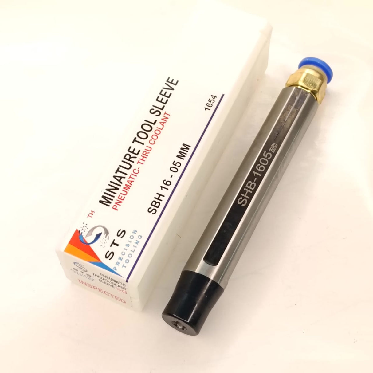 Metal tool with a box labeled 'STS'