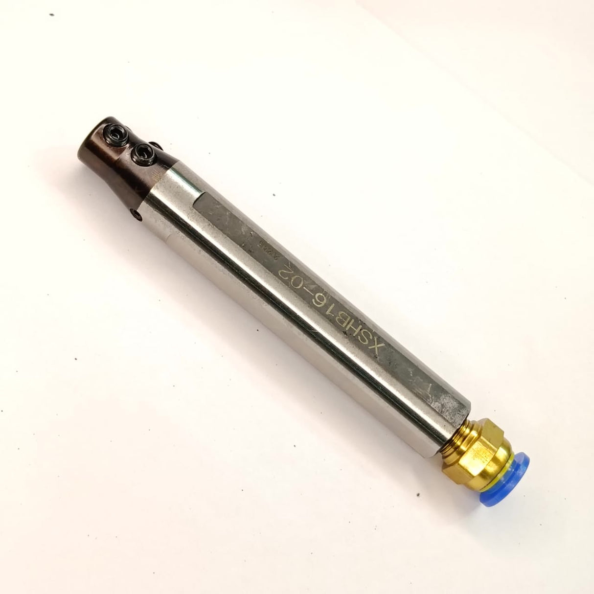 Metal tool with brass fitting
