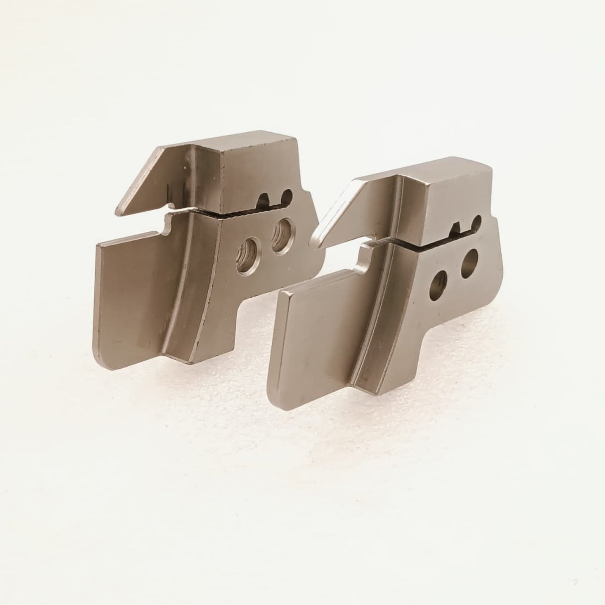 Two metal tool inserts