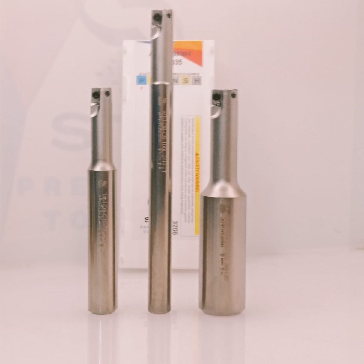 Three metal cylindrical tools