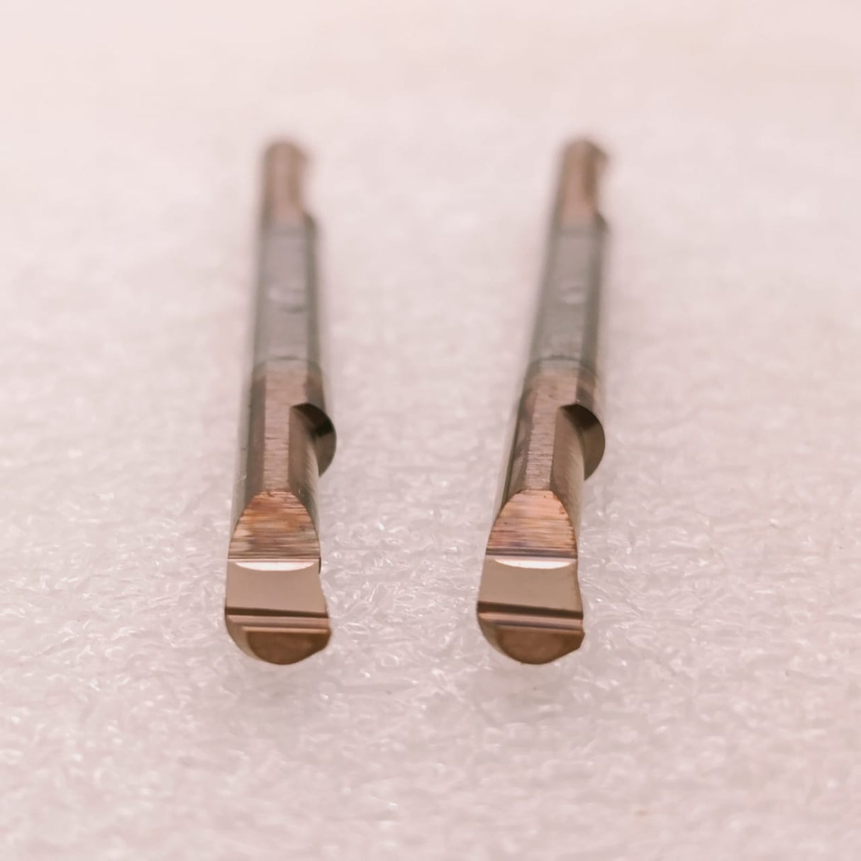 Two metal turning tool inserts