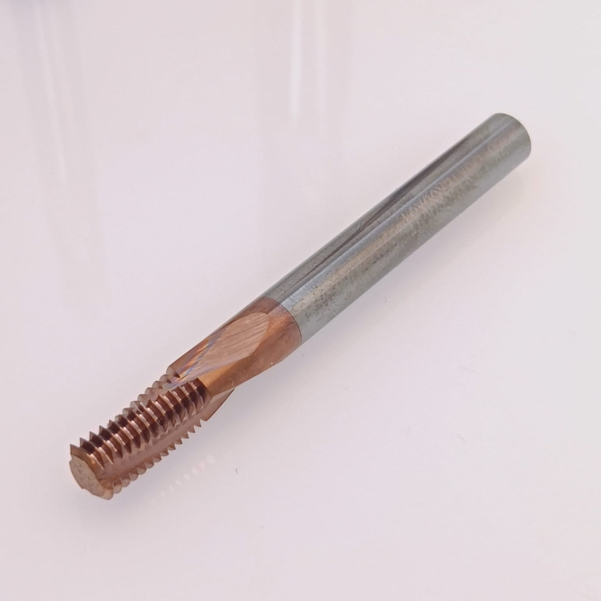 Coated metal thread cutting tap