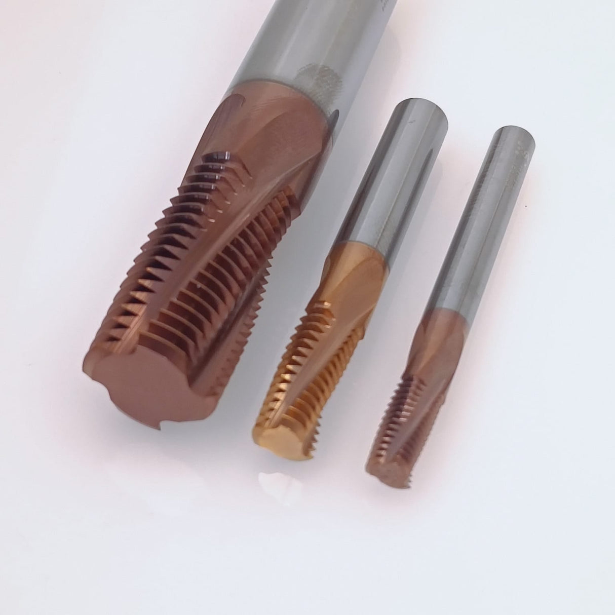 Three coated metal thread taps