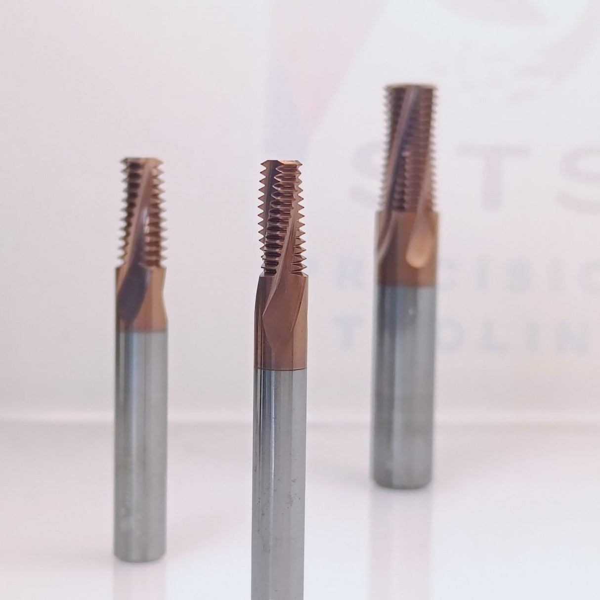 Three coated metal thread taps